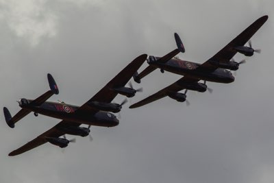 Two Lancasters, with a Spitfire and a Hurricane 